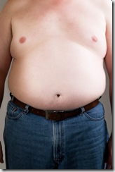 Overweight man poses for a before picture.